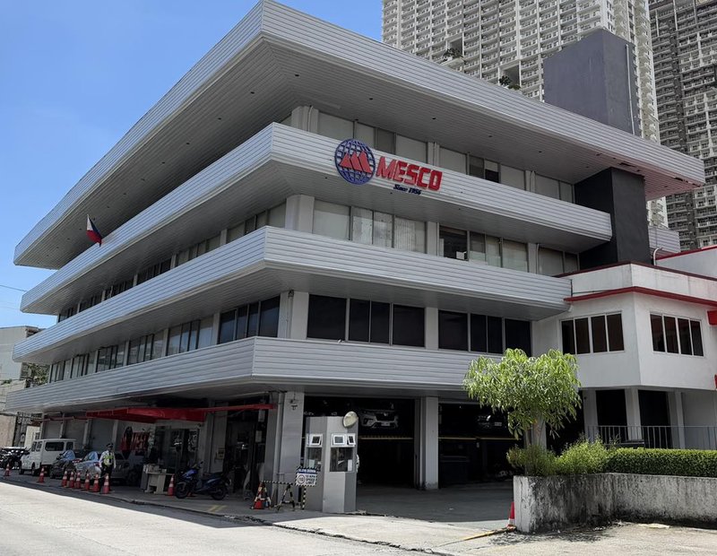 The MESCO building in Pasig today: a three-tier white facade with the MESCO logo